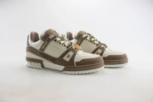 Tyler x Louis Vuitton Trainer sneakers in brown and white, showcasing luxury design elements and craftsmanship details.