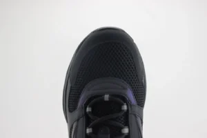 Dior B22 shoes featuring a sleek black mesh and cowhide upper, showcasing a thick rubber sole with embossed “CD” logo, presented from a top-down view.
