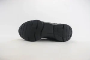 Black rubber sole of Dior B22 shoes showcasing tread design and low-cut profile, emphasizing luxury sneaker features.