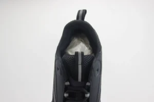 Dior B22 shoes showcasing the interior view, featuring a black upper with mesh fabric and a padded collar, designed for luxury and comfort.