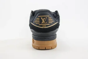 Louis Vuitton Trainer sneaker featuring a distinctive rear view with the iconic LV logo and a stylish black and brown color scheme, emphasizing luxury craftsmanship and design.