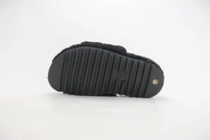 Black sole of Louis Vuitton slippers featuring textured grip, designed for luxury comfort and indoor/outdoor wear.