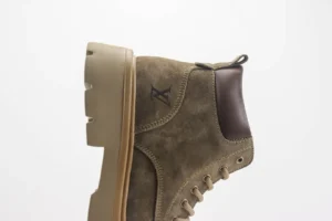 Louis Vuitton casual yellow boot featuring a suede upper, brown leather accents, and a lightweight rubber sole, part of the Autumn/Winter collection.