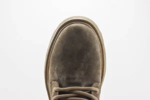 Top view of a Louis Vuitton boot featuring a smooth, textured upper and lace design, emphasizing luxury footwear from the Autumn/Winter collection.