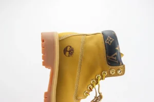 Timberland boots yellow leather with brown leather monogram collar and lug rubber sole sneakers