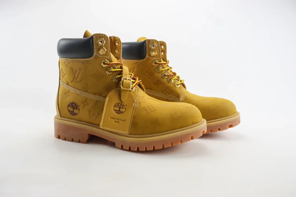 Louis Vuitton Timberland collaboration boots yellow monogram leather with black padded collar and gum sole sneakers