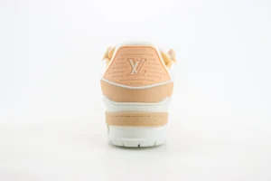 Louis Vuitton Trainer Low Cut Casual sneaker rear view with logo, featuring a peach and white color scheme, displayed on a plain background.