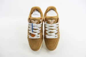 Louis Vuitton Trainer low-cut casual shoes in tan suede with white laces and logo, showcasing luxury replica footwear design.