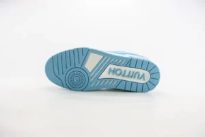 Louis Vuitton Trainer low-cut casual shoe sole featuring a blue design and prominent "VUITTON" logo, showcasing luxury footwear details.