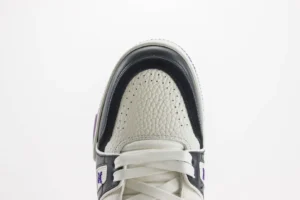 Louis Vuitton Trainer low-cut casual sneaker showcasing detailed upper design, featuring premium materials and unique color accents, ideal for luxury footwear enthusiasts.