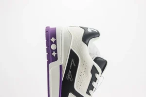 Louis Vuitton Trainer low-cut casual sneakers featuring a black, white, and purple color scheme, showcasing luxury design elements and branding.