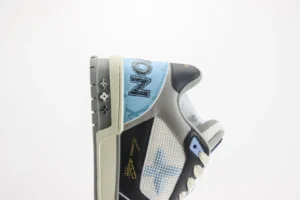 Louis Vuitton Trainer Limited Edition sneaker with a stylish design featuring a mix of colors, mesh material, and prominent branding elements.