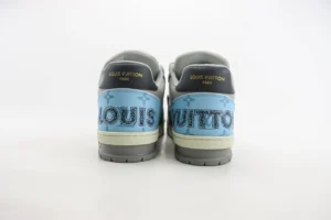 Louis Vuitton Trainer Limited Edition sneakers featuring a blue and gray colorway with prominent logo detailing on the heel.