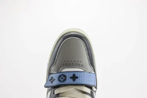 Louis Vuitton Trainer Limited Edition sneaker with distinctive blue strap and logo details, showcasing high-quality craftsmanship and design.