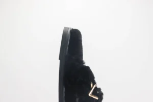 Louis Vuitton fur loafers black shearling leather gold LV accent slip-on shoes