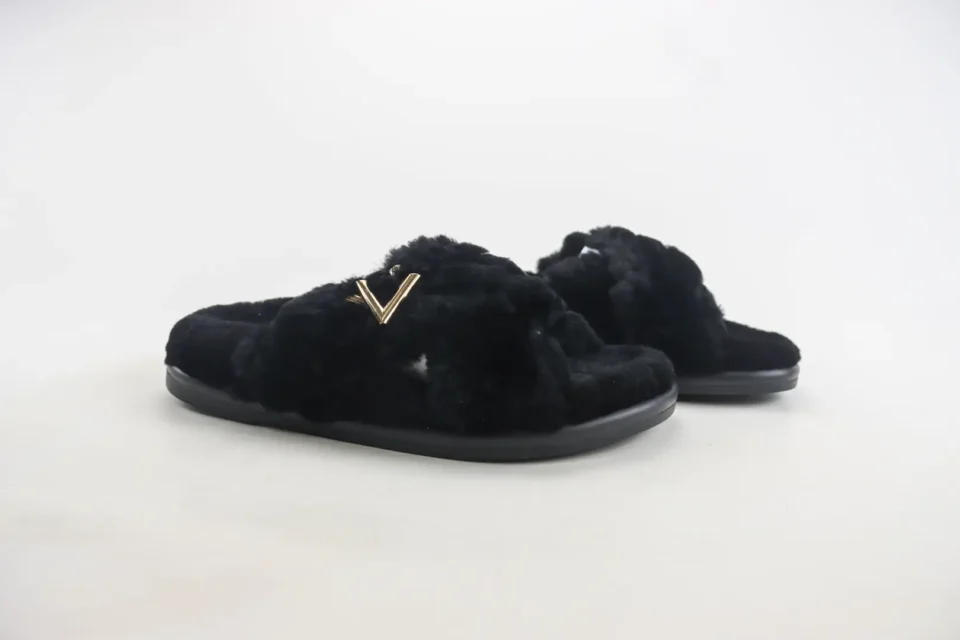 Valentino slippers black faux fur slippers with gold V logo and rubber sole slippers