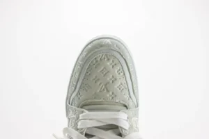 Louis Vuitton LV Trainer sneaker white embossed leather with monogram detail and white laces