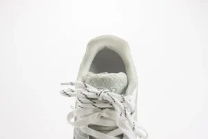 Louis Vuitton LV Trainer sneaker white monogram embossed leather luxury footwear