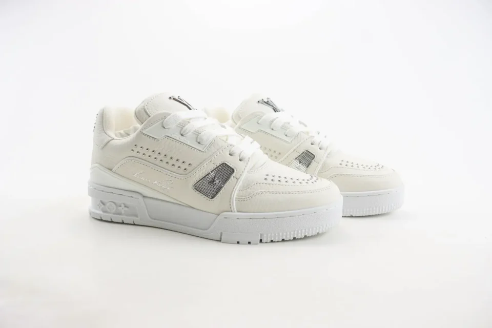 Louis Vuitton Trainer Sneaker white leather low-top athletic shoes with silver studs and logo accents