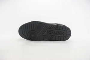 Louis Vuitton LV Trainer black rubber sole sneakers with embossed logo and textured tread pattern