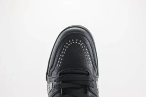 Air Jordan 4 Black Cat black leather sneakers with stud detailing on toe box and classic lace design