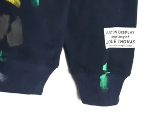 Arton Display sweatshirt navy cotton with colorful paint splatter and Josu&eacute; Thomas label on sleeve