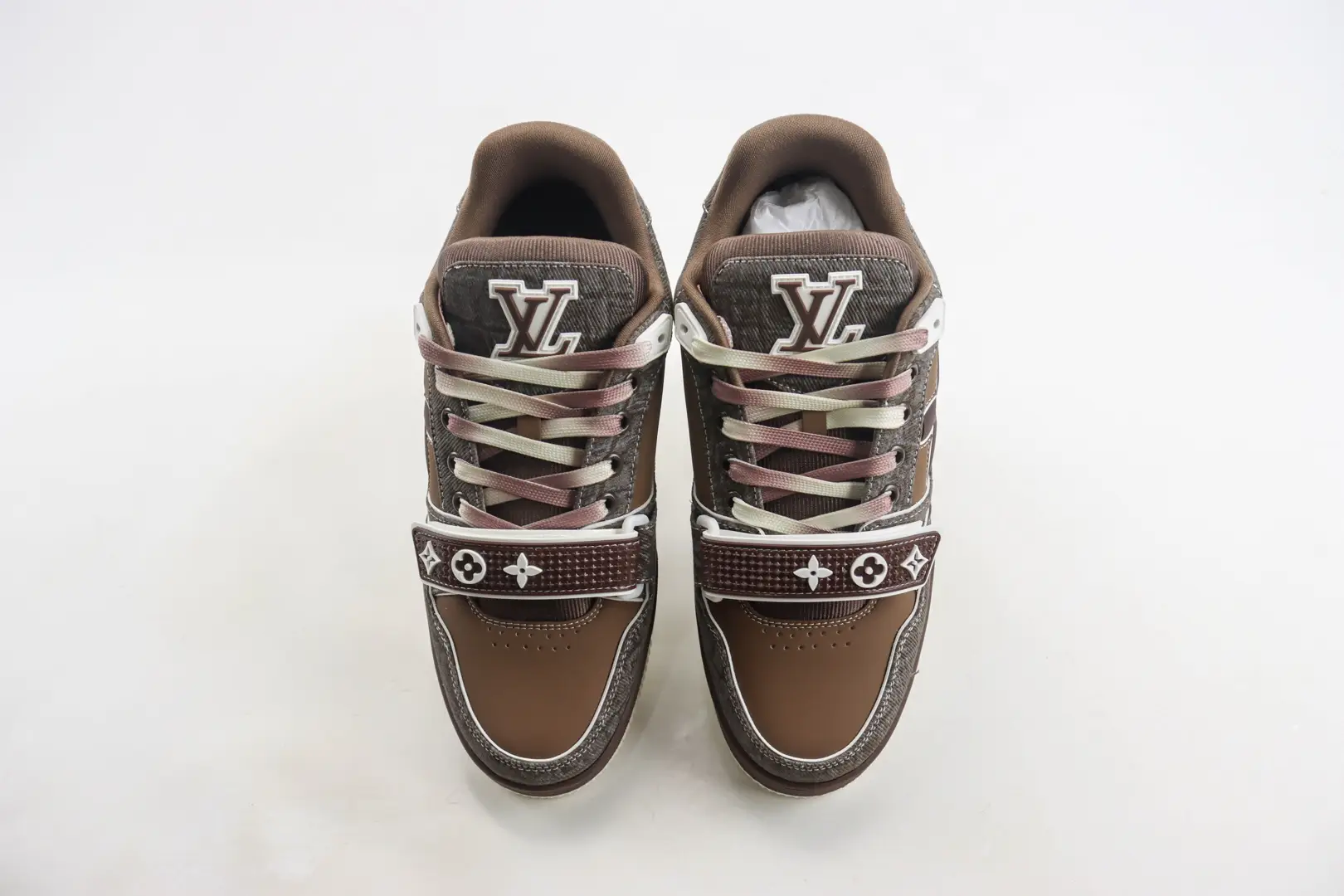 Louis Vuitton Trainer limited edition low-cut casual board shoes in brown and gray, featuring iconic LV logo and signature design elements.