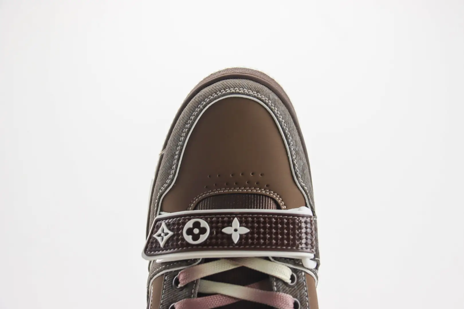 Louis Vuitton Trainer Limited Edition low-cut casual board shoe featuring a brown and gray color scheme, with distinctive logo detailing on the strap and laces.