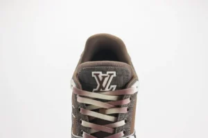 Louis Vuitton Trainer Limited Edition low-cut casual board shoe with prominent LV logo and stylish lacing design, featured in a minimalist setting.