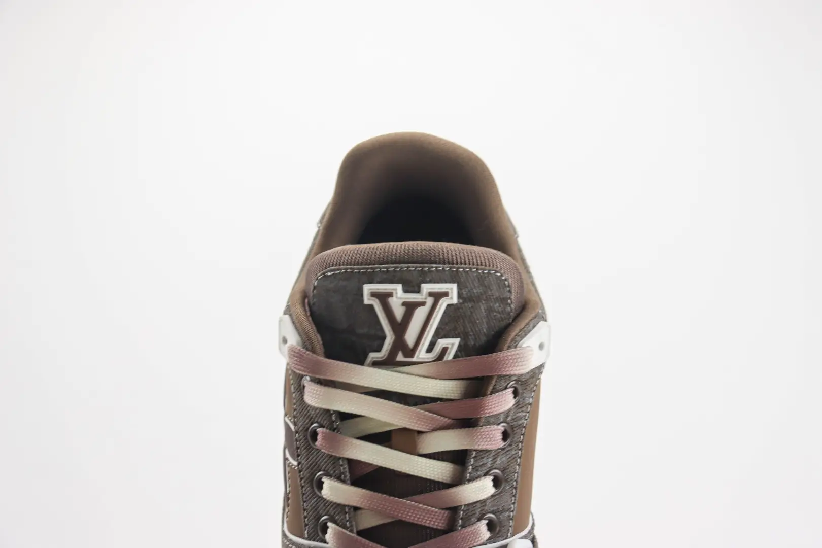 Louis Vuitton Trainer Limited Edition low-cut casual board shoe featuring brown and gray color scheme, prominent LV logo, and stylish lacing design.
