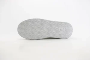 Louis Vuitton Trainer white rubber sole sneaker with embossed monogram pattern and herringbone tread