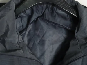Interior view of Dior Men’s Technical Fabric Hooded Jacket showcasing the sleek lining and collar design.
