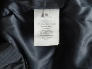 Dior Men's Technical Fabric Hooded Jacket care label showing size XS and fabric composition details.