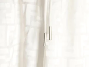 Fendi FF Dark Pattern Jacquard Beach Shorts with drawstring detail and metallic tips, showcasing luxury design elements.