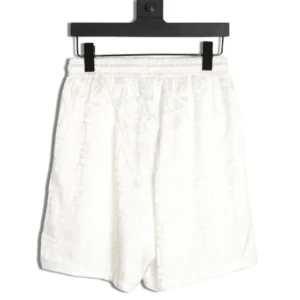 Fendi FF Dark Pattern Jacquard Beach Shorts displayed on a hanger, featuring a white color and relaxed fit, highlighting designer luxury apparel available for purchase.