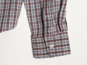 MIU MIU brown and blue fine grid long sleeve shirt cuff with custom button detail, showcasing luxury fabric and craftsmanship.