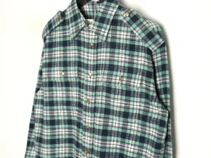 Celine green plaid flannel long-sleeved shirt featuring two flap pockets and a button-up design, showcasing casual style and premium craftsmanship.