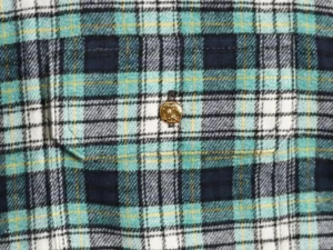 Celine green plaid flannel shirt featuring two flap pockets and Arc de Triomphe button detail.