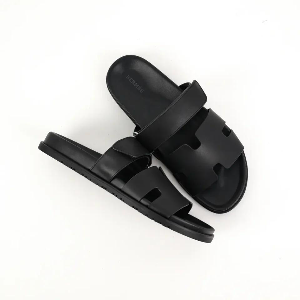 Herm&egrave;s Oran slides black calfskin leather sandals with signature H cutout design