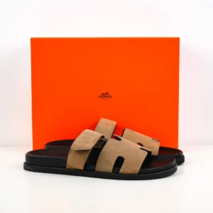 Hermès Oran sandals beige suede upper black rubber sole slip-on slides
