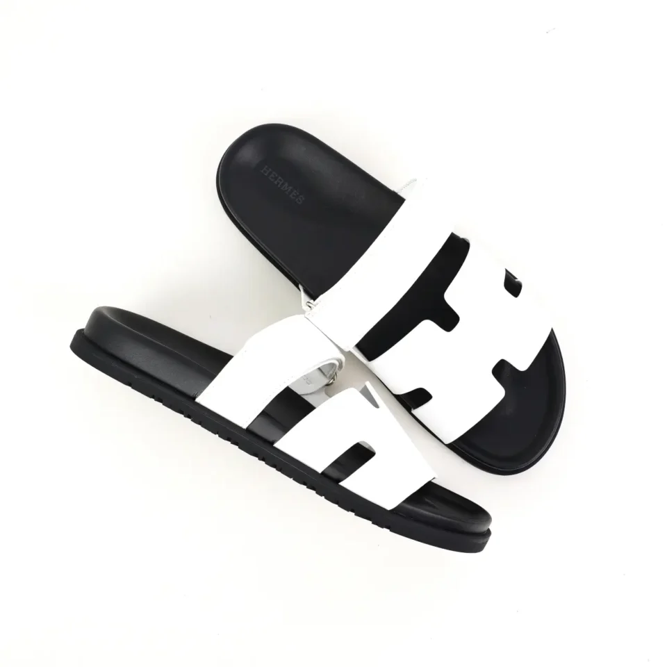 Herm&egrave;s Oran sandals white black leather slip-on sandals with cut-out design and rubber sole
