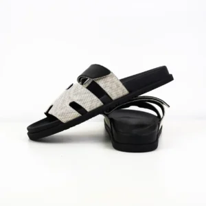 Hermes Oran sandals black white perforated leather slides with cushioned sole