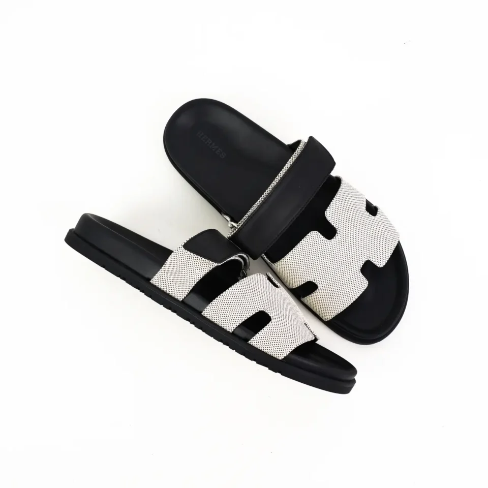 Hermes Oran sandals black white leather slides with perforated H design and rubber sole