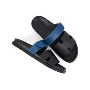Hermes Oran sandals black blue leather slides with cutout design and adjustable strap