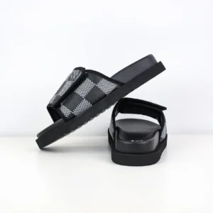 Lv Miami Damier Round Head One Word Slippers in black and gray checkered pattern, showcasing luxury footwear design and style.
