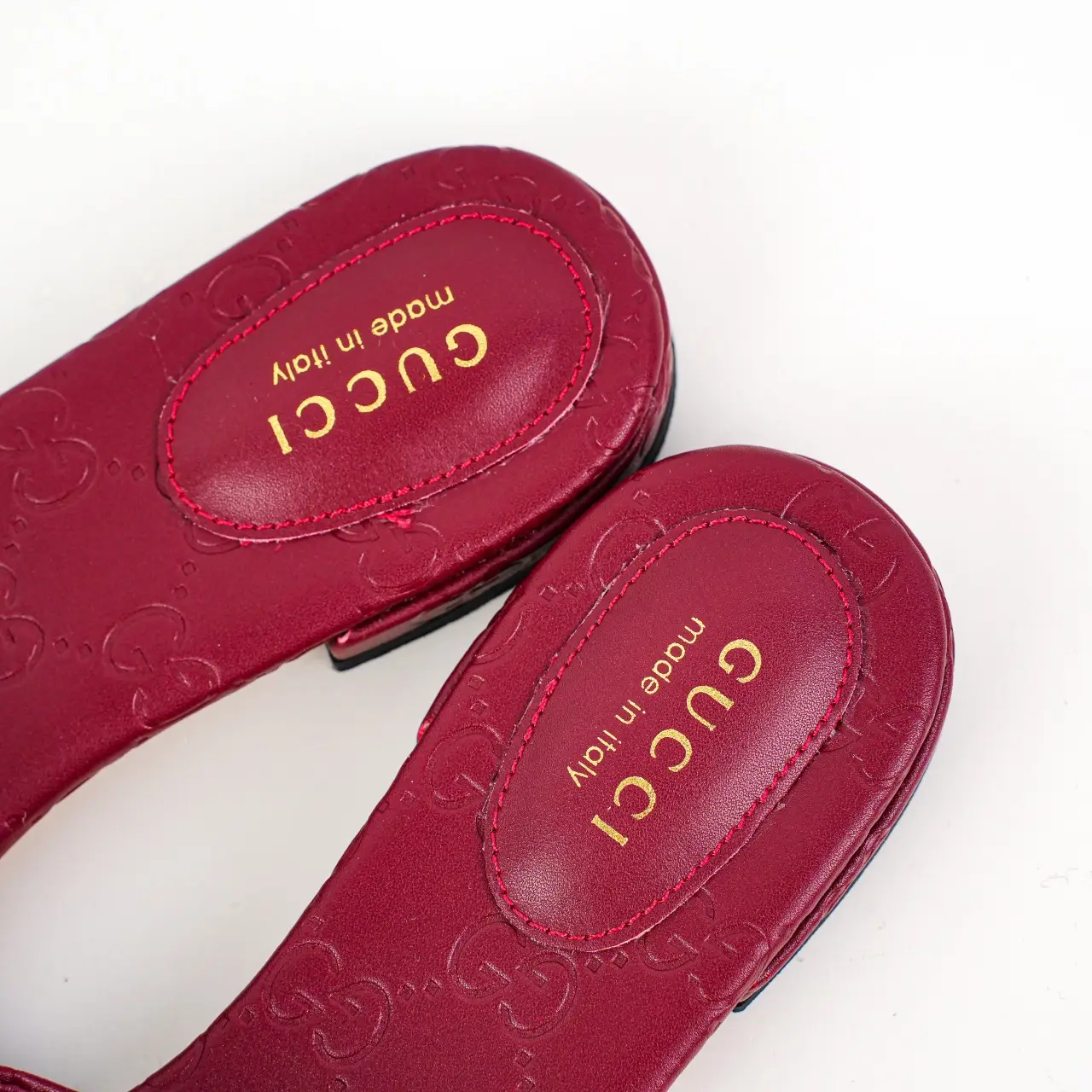 Gucci slippers red leather embossed interlocking G logo made in Italy luxury footwear