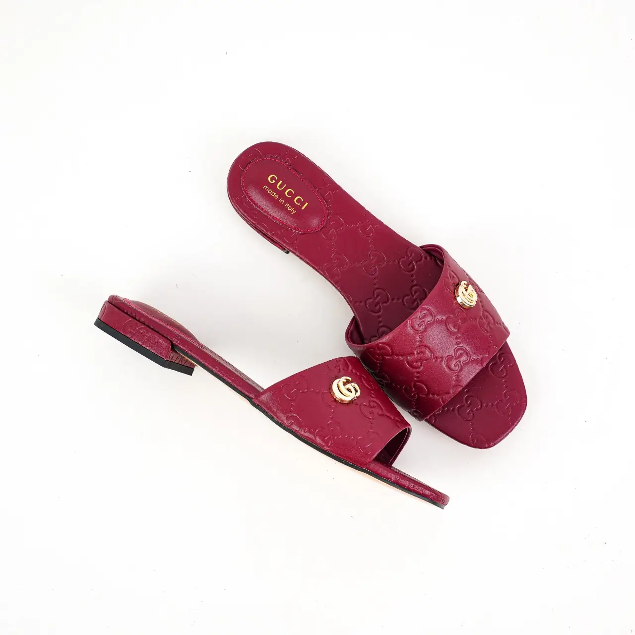 Gucci leather slide sandals red color embossed pattern gold GG logo hardware flat sole shoes