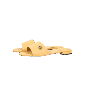 Gucci Double G women's slippers in yellow sheepskin leather, showcasing open-toe design and logo detail, featured on RepsGoat for affordable designer footwear.