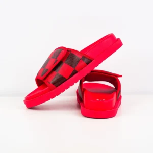Red and black Louis Vuitton Miami Damier Round Head One Word Slippers displayed from the side and rear, emphasizing luxury design and vibrant color.