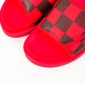 Louis Vuitton Miami Damier Round Head One Word Slippers featuring a red and black checkerboard design, emphasizing luxury and style.